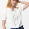 V-halsbluse i bomulls-dobby for damer